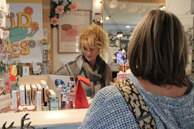 Shari Aussant serving a customer.