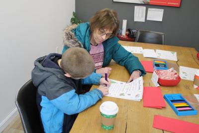 Children write letters to Santa.