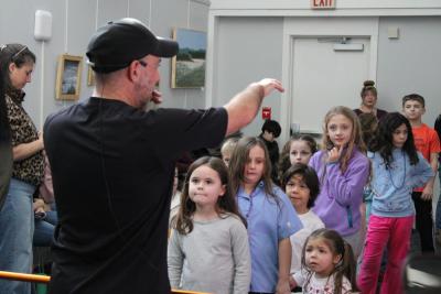 DJ Ooch directs the crowd during limbo.