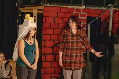 Brianna Gabrey as Christmas Past and Lilyan Medina as Scrooge.