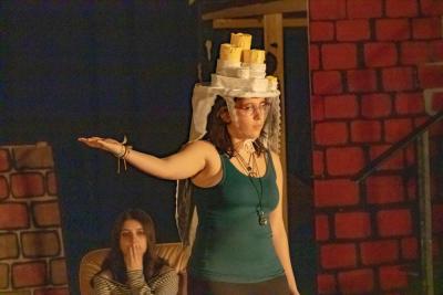 Christmas Past gestures to memories of Scrooge being cruel.