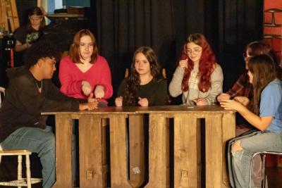 Smack dab in a final celebration, Evelyn Medina is Tiny Tim.