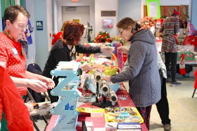 Shoppers peruse the items.