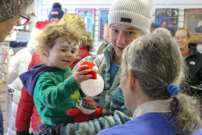 Morgan Sousa gets a new ornament. Photos by Brandy Muz