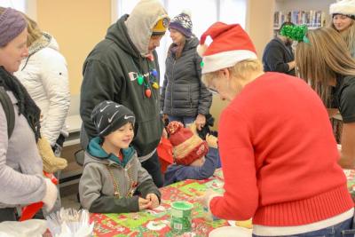 Maxx Phillips Jr decorates cookies at the library.
