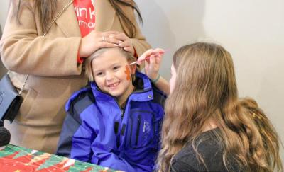 Keegan Bartlett gets his face painted.