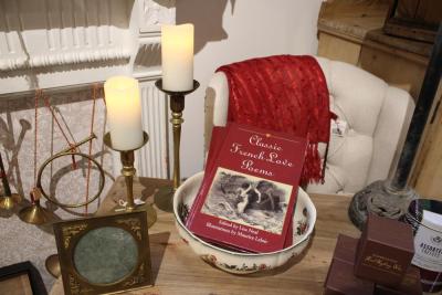 A display set up with a book with items from across the sea.