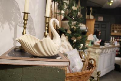 A swan bowl sits near the register.