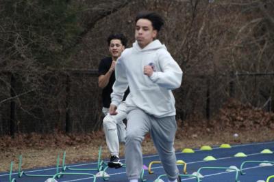 Practing alongside his teammates Owen Dillen runs. 