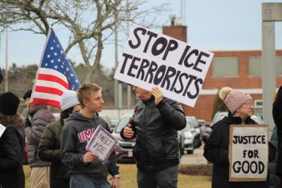 Manfred Wiegandt speaks to a young protestor. 
