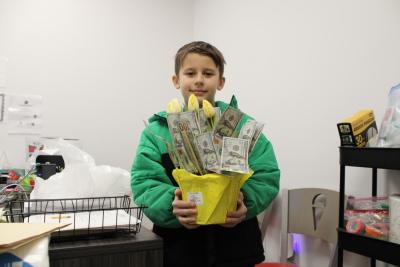 Will Boucher and his bouquet of $100 bills. Photos by Brandy Muz