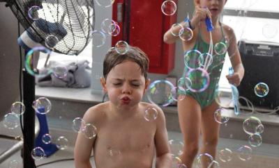 Lincoln, 5, tries his best to blow the bubbles around. 