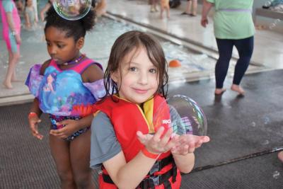 Jackson, 5, holds a bubble he caught.