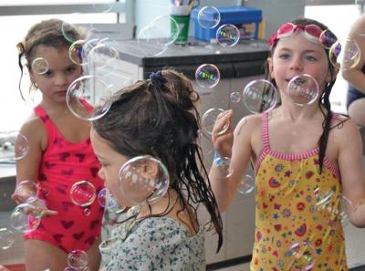 Some kids enjoy the bubbles.