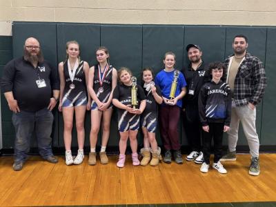 The team with their coaches. 