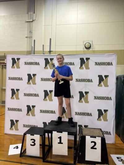 Quinn Perry and her big first place trophy. 