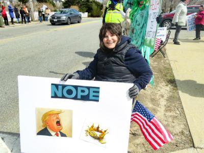 Mary Stanton holds up her sign. 