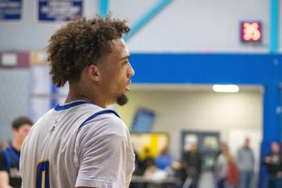 Amare Rose looks down court. 