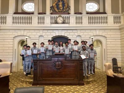 The team with Dooner on the house floor. Photos source: Wareham High School
