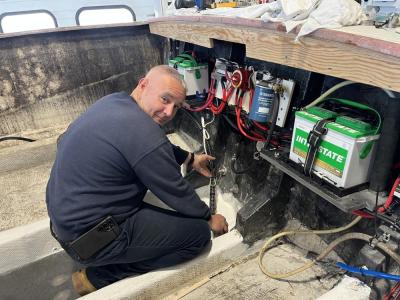 Doze working on one of many boats within the shop. Photos by Brandy Muz