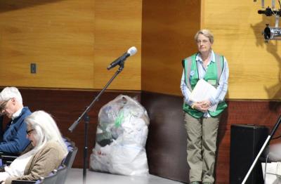 Hilary Greene with her bag of plastic bags, emphasizing over-usage. 