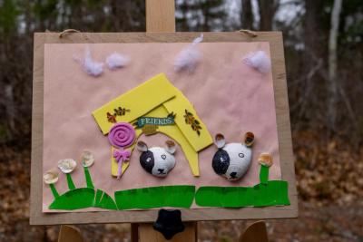 One piece of art shell-abrates a pair of dogs. 