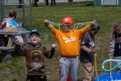 Myles Pfeiffer and Sterling Winters play with bubbles between games. 