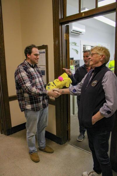 Josh Faherty and Lisa Johnson shake hands. 