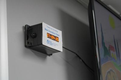 A sign shows the date of the vehicle's next drive. 