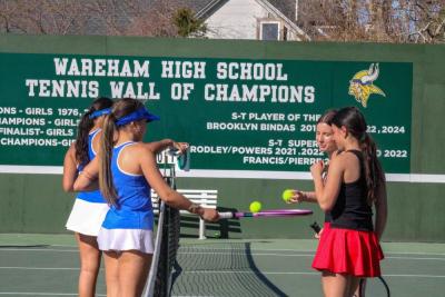 Wareham and Old Rochester players chat at the net. 