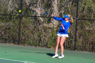 Malia O'Connor returns a hit. 
