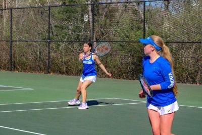 Salem and O'Connor during a doubles match. 