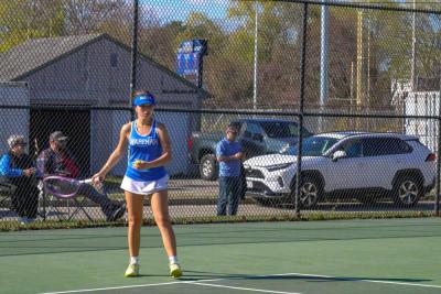 Yvonne Pina-Monteiro prepares to serve. 