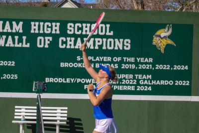 A Wareham player stretches to hit an overhead ball. 