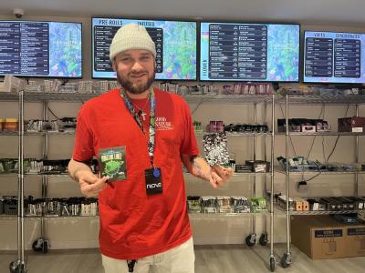 Jose Lemos poses with some of the shops new product. Photos by Brandy Muz