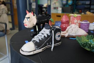 A sculpture of a converse shoe created by Ryan Dame