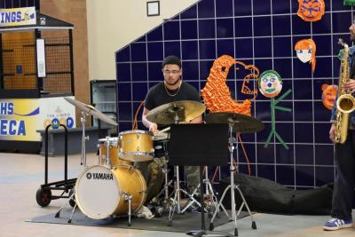The high school band invited alumni, like Malachi Samuels who graduated in 2024, to play with them.