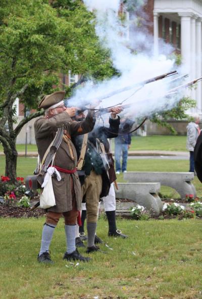 The minutemen fire their rifles.