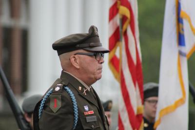 Matthew Stanton stands among flags.