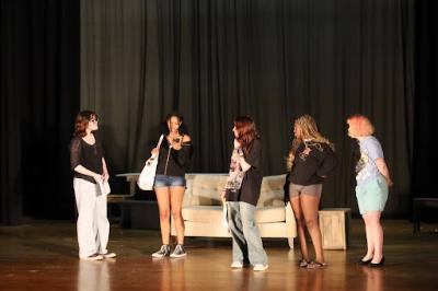 The cast prepares for opening night by rehearsing scenes.