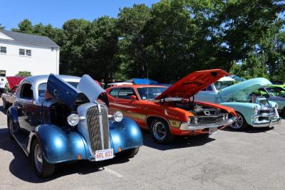 Cars with hoods open