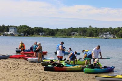 Kayakers get in their boats