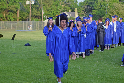 Isis Viera beams as he goes to get his diploma. 