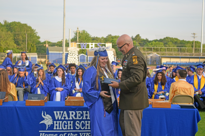 Ava Knight receives her diploma from Colonel Stanton. 