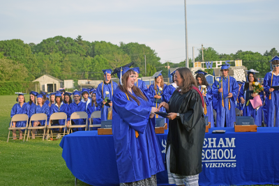 Abigal Balano was quite excited to receive her diploma from Lisa Ohman. 