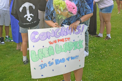 A sign supporting a graduate. 