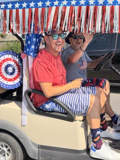 Kevin Legault and Joe Legault rode in a decorated golf cart in the parade. 