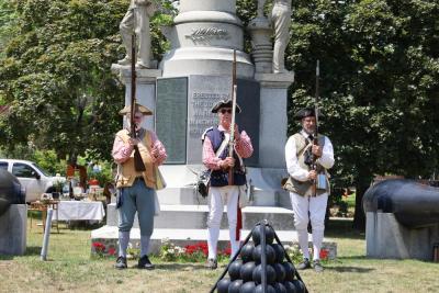 Mack Phinney, Howie Smith and Gary Franklin were part of the militia that fired a volley at the Antique Faire. 