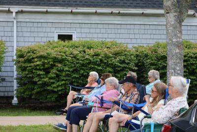 Concertgoers watch the performance. 