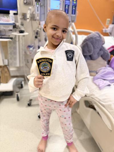 Mia wears patches gifted by the Abington Police Department. The community has come together in different ways to show support for the young girl. “Community is so strong, and there is good in people. Things like this really bring out that good in people,” Lunettasaid.